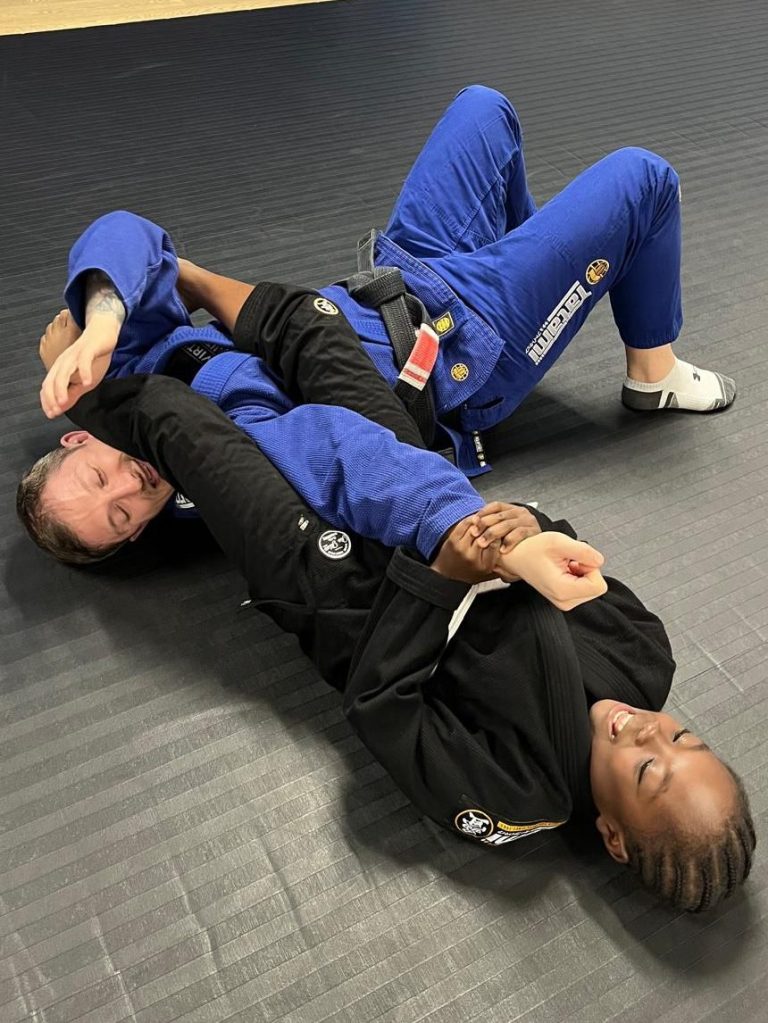 Mike Buckman-Cowling getting armlocked by one of the students from the Junior class.